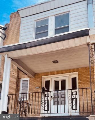 5915 Palmetto St, Philadelphia, PA 19120 - property entrance with brick siding and covered porch