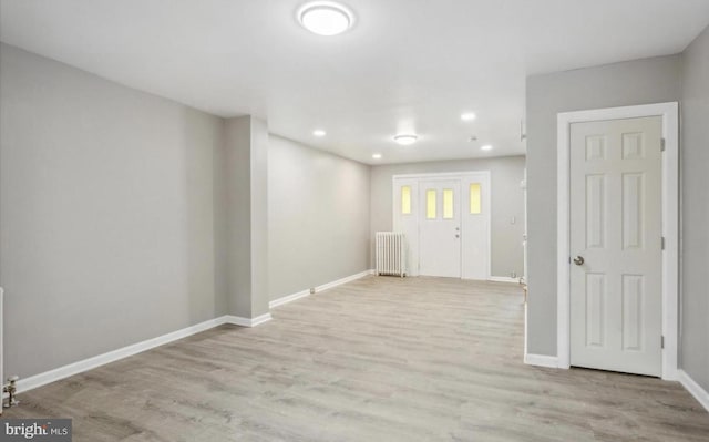 5915 Palmetto St, Philadelphia, PA 19120 - below grade area featuring baseboards, recessed lighting, wood finished floors, and radiator
