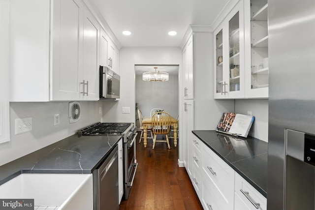kitchen featuring recessed lighting, dark wood-style flooring, a notable chandelier, white cabinetry, and appliances with stainless steel finishes