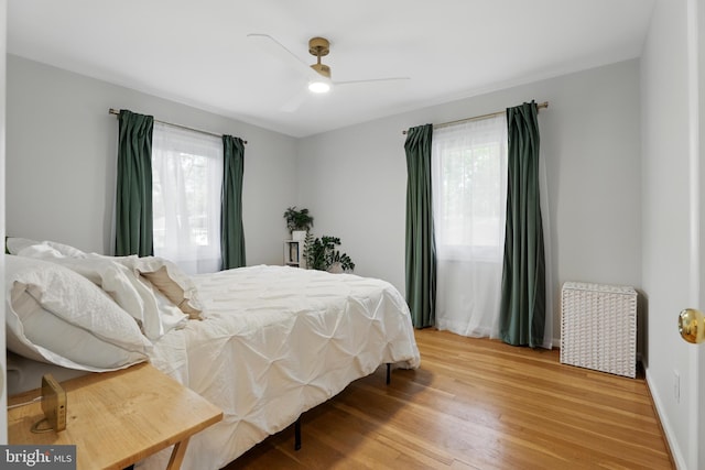 bedroom featuring light wood finished floors and a ceiling fan