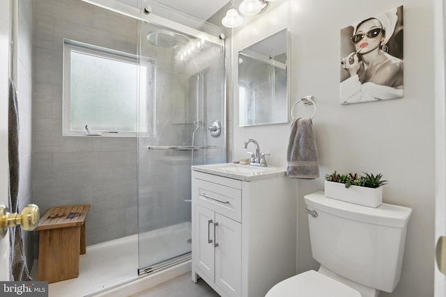 full bath with a shower stall, toilet, and vanity
