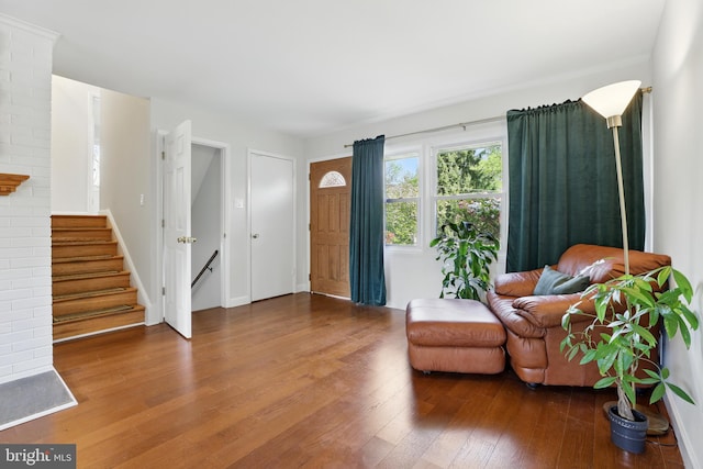 sitting room featuring hardwood / wood-style floors and stairs