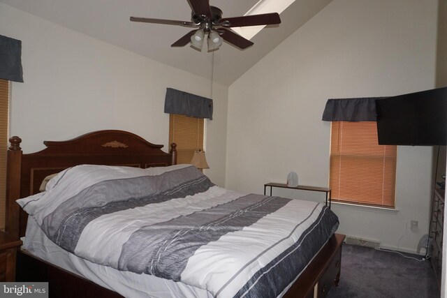 carpeted bedroom featuring high vaulted ceiling and ceiling fan