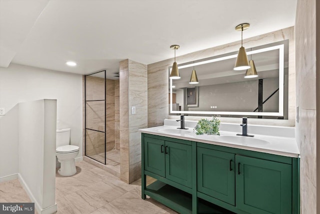 bathroom featuring baseboards, marble finish floor, a sink, and toilet
