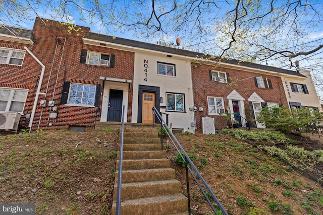 multi unit property with brick siding and ac unit