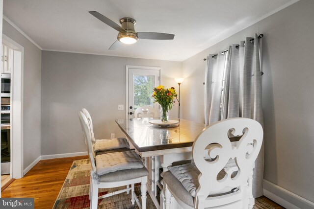 6 Shover Dr, Carlisle, PA 17013 - dining space with light wood-style flooring, crown molding, baseboards, and ceiling fan