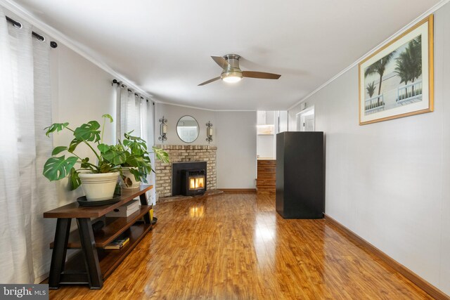6 Shover Dr, Carlisle, PA 17013 - living room with light wood finished floors, baseboards, a ceiling fan, a fireplace, and ornamental molding