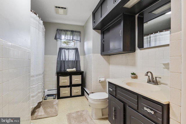 6 Shover Dr, Carlisle, PA 17013 - full bath with tile walls, visible vents, toilet, and baseboard heating