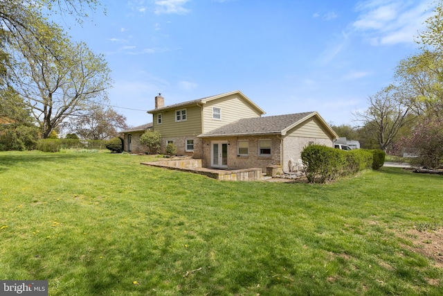 6 Shover Dr, Carlisle, PA 17013 - rear view of house featuring a lawn, a chimney, brick siding, and a patio
