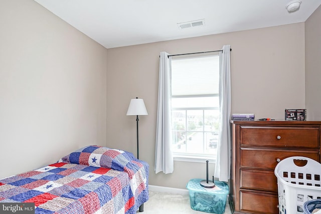 bedroom with visible vents, carpet flooring, and baseboards