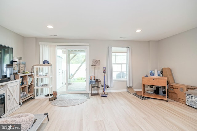 interior space with recessed lighting, baseboards, and wood finished floors