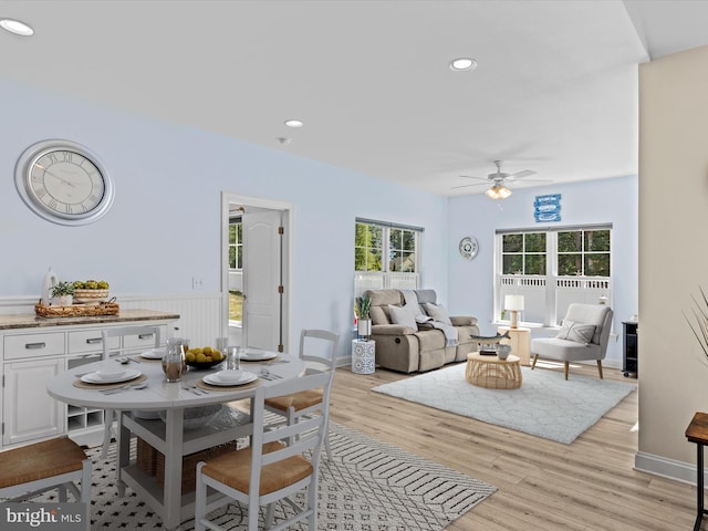 dining room featuring light wood-type flooring, wainscoting, recessed lighting, and ceiling fan