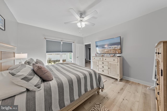 bedroom featuring baseboards, a ceiling fan, and light wood-type flooring