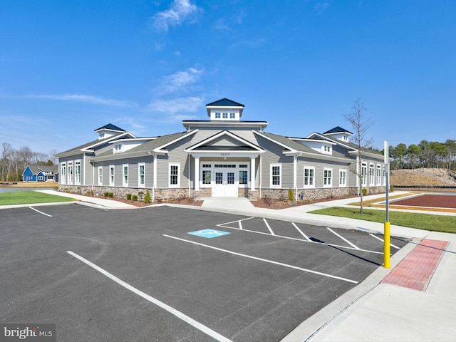 view of building exterior featuring uncovered parking