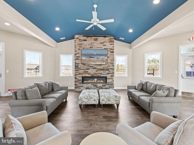 living room with a fireplace, vaulted ceiling, baseboards, and ceiling fan