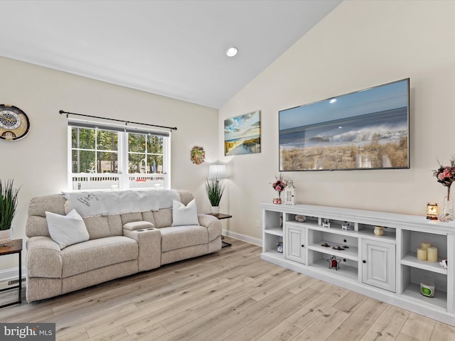 living area with recessed lighting, light wood-style floors, and high vaulted ceiling