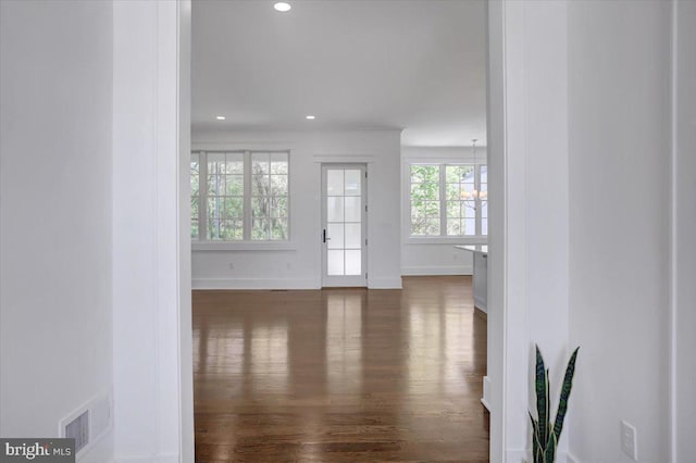 interior space with visible vents, recessed lighting, dark wood finished floors, and baseboards