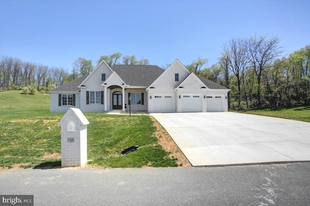 view of front of house featuring concrete driveway, an attached garage, a front yard, and stucco siding