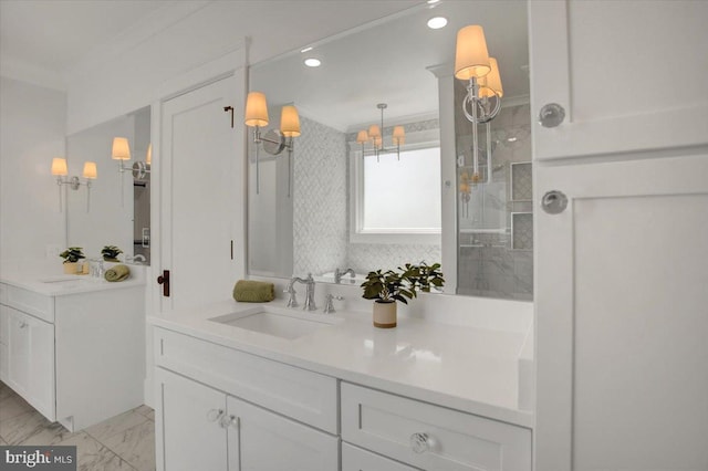 bathroom with two vanities, a shower stall, a sink, and marble finish floor