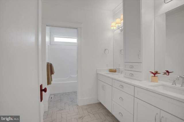 full bath with a sink and double vanity