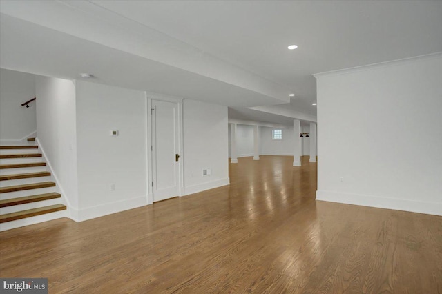 interior space featuring stairs, recessed lighting, baseboards, and wood finished floors