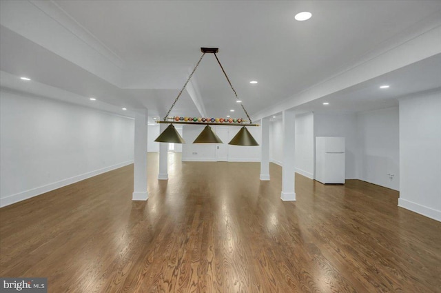 basement featuring baseboards, freestanding refrigerator, wood finished floors, and recessed lighting