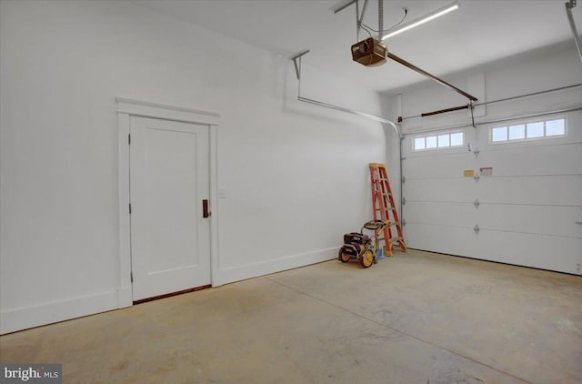 garage featuring baseboards and a garage door opener