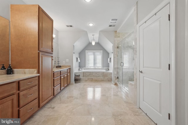 full bathroom featuring a garden tub, visible vents, vaulted ceiling, a shower stall, and vanity