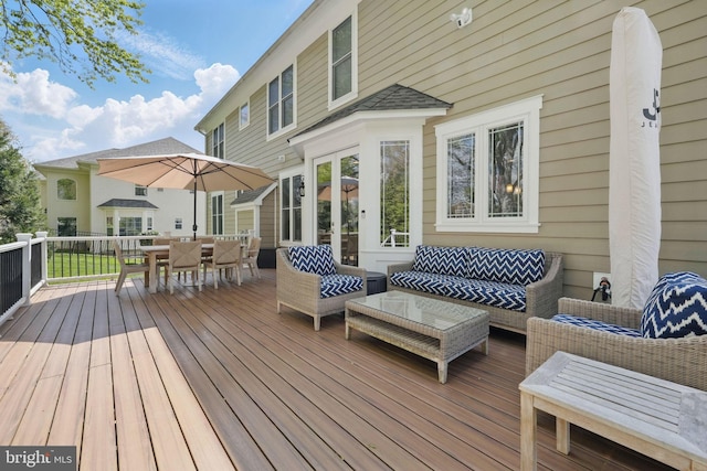 deck featuring an outdoor hangout area and outdoor dining area