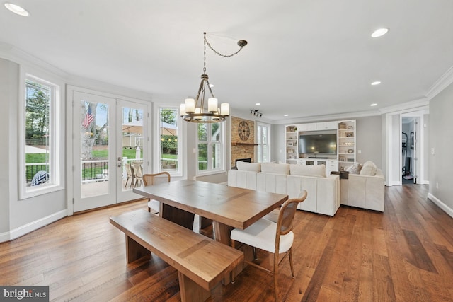 10008 Murnane St, Vienna, VA 22181 - dining space featuring crown molding, wood finished floors, baseboards, a chandelier, and recessed lighting