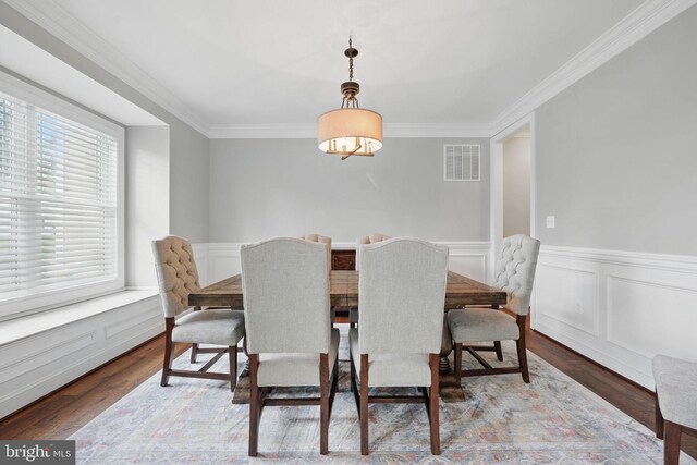 10008 Murnane St, Vienna, VA 22181 - dining area with a wainscoted wall, ornamental molding, wood finished floors, and visible vents