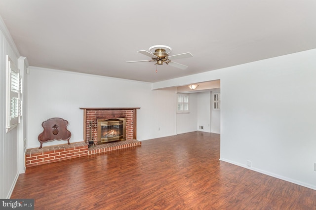 3108 Battersea Ln, Alexandria, VA 22309 - unfurnished living room featuring wood finished floors, ceiling fan, a brick fireplace, baseboards, and crown molding