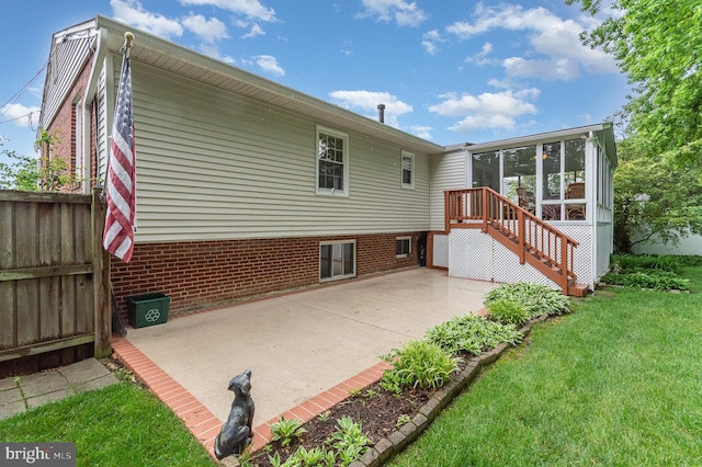 3108 Battersea Ln, Alexandria, VA 22309 - back of house with a sunroom, a patio, stairs, and brick siding