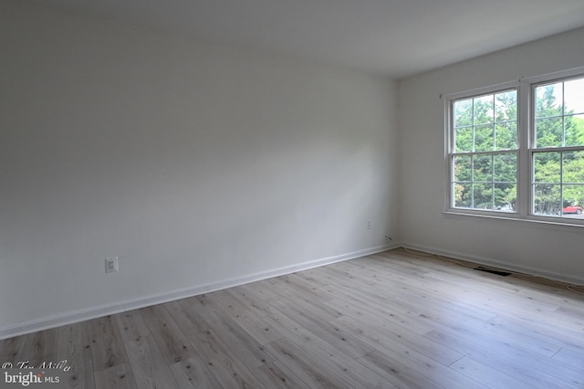 19142 Highstream Dr Unit 679, Germantown, MD 20874 - unfurnished room featuring baseboards, wood finished floors, and visible vents