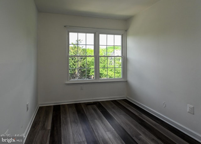 19142 Highstream Dr Unit 679, Germantown, MD 20874 - spare room featuring baseboards and dark wood-style flooring