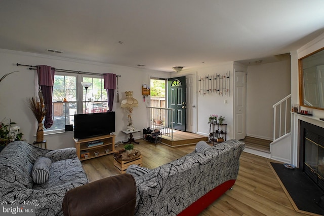 19142 Highstream Dr Unit 679, Germantown, MD 20874 - living room with visible vents, stairs, and wood finished floors