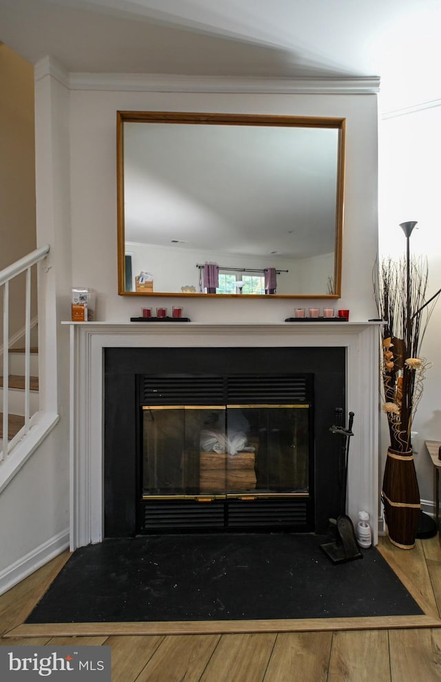 19142 Highstream Dr Unit 679, Germantown, MD 20874 - interior details with baseboards, a fireplace with flush hearth, and wood finished floors
