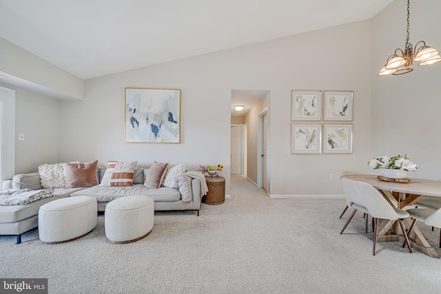 8818 Tanglewood Ln, Manassas, VA 20110 - living room featuring high vaulted ceiling, baseboards, an inviting chandelier, and light carpet