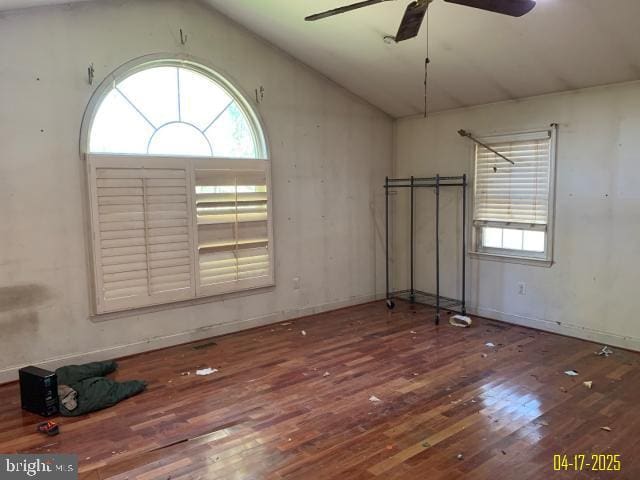 unfurnished room with ceiling fan, vaulted ceiling, and hardwood / wood-style flooring