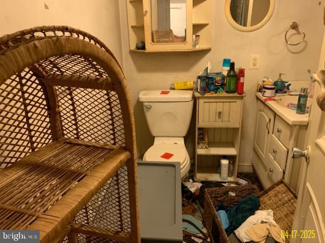 bathroom featuring vanity and toilet