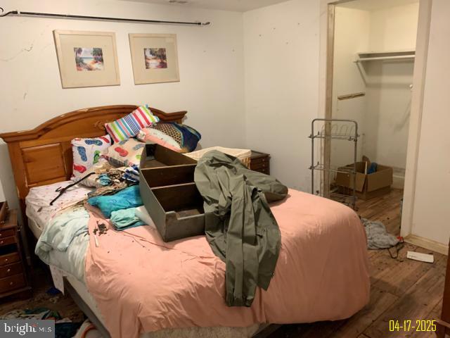 bedroom with wood finished floors