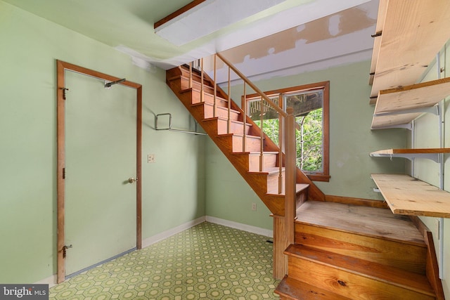 stairway with baseboards