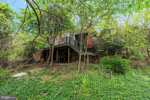 back of property featuring a deck