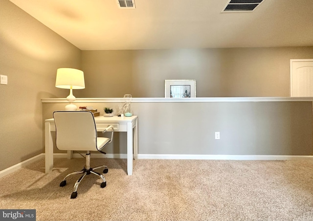 office space featuring baseboards, carpet flooring, and visible vents