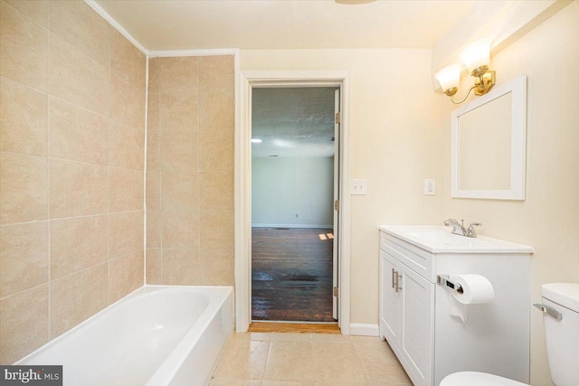 bathroom with toilet, tile patterned floors, and vanity