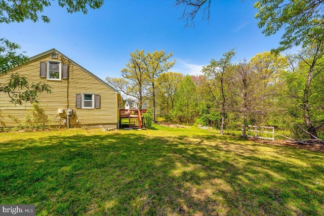 view of yard featuring a wooden deck
