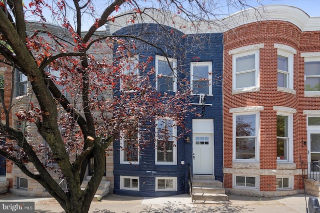 multi unit property with brick siding and entry steps