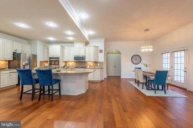 24129 Statesboro Pl, Ashburn, VA 20148 - kitchen with stainless steel appliances, dark wood-style floors, an inviting chandelier, and crown molding