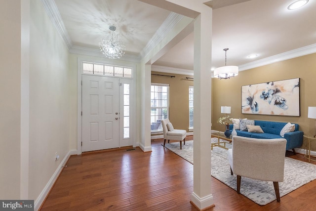 24129 Statesboro Pl, Ashburn, VA 20148 - foyer entrance featuring a chandelier, hardwood / wood-style floors, baseboards, and ornamental molding