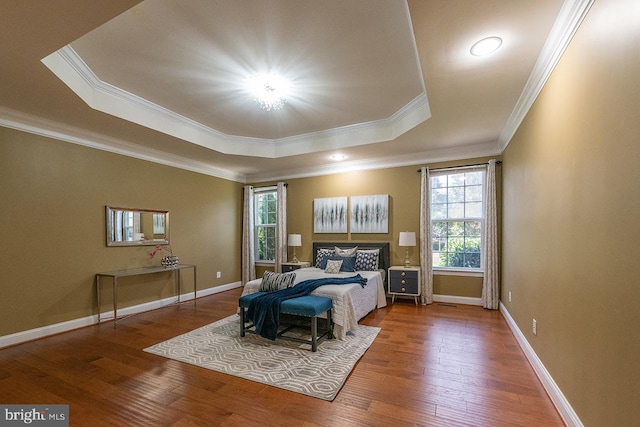 24129 Statesboro Pl, Ashburn, VA 20148 - bedroom featuring wood-type flooring, a raised ceiling, baseboards, and ornamental molding